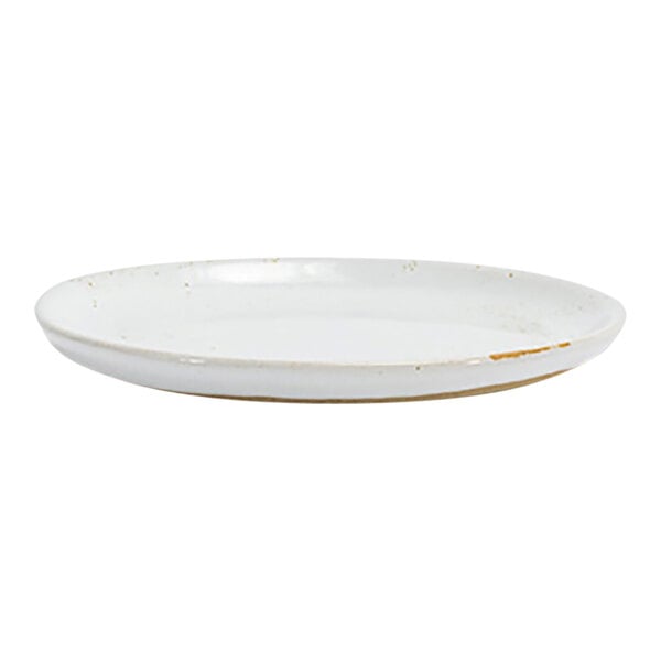 A small round white porcelain plate with a slightly raised edge.