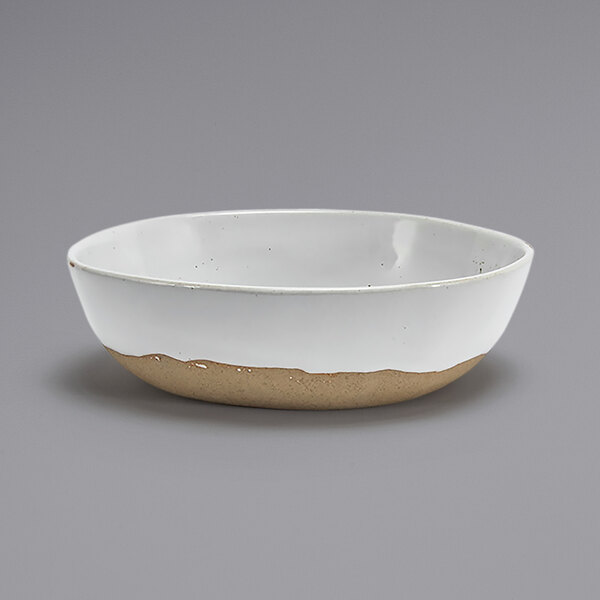 A white bowl with a brown rim.