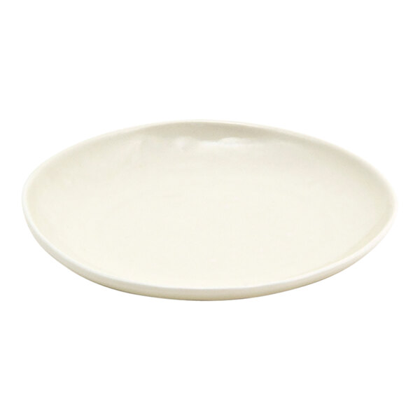 A small round vanilla bean-colored porcelain plate.