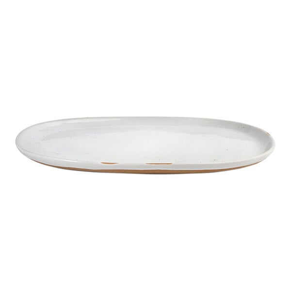 An oval white porcelain plate with a slightly raised rim.