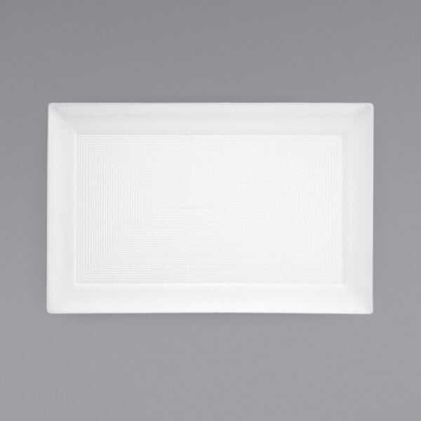 A Front of the House white rectangular porcelain plate on a gray background.