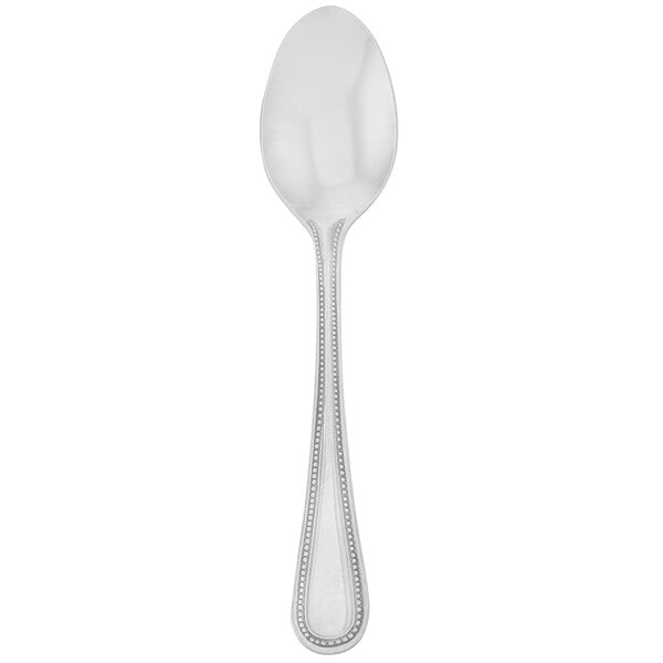 A close-up of a Walco Accolade stainless steel teaspoon with a beaded design on the handle.