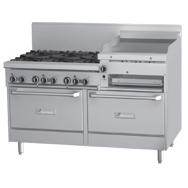 A large stainless steel Garland commercial gas range with six burners, a raised griddle, and two standard ovens.