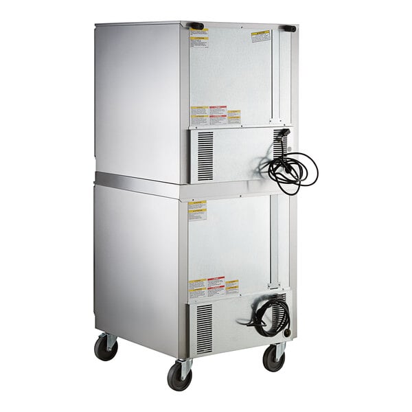 A Beverage-Air white double stacked rectangular machine with wheels and glass doors.