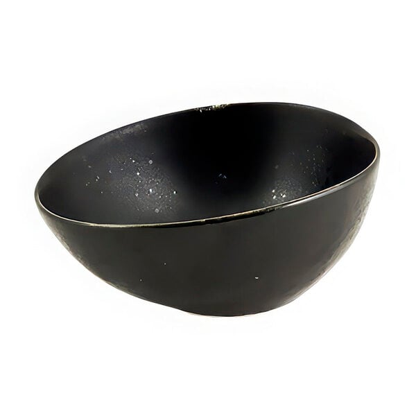 A black porcelain ramekin with white specks.