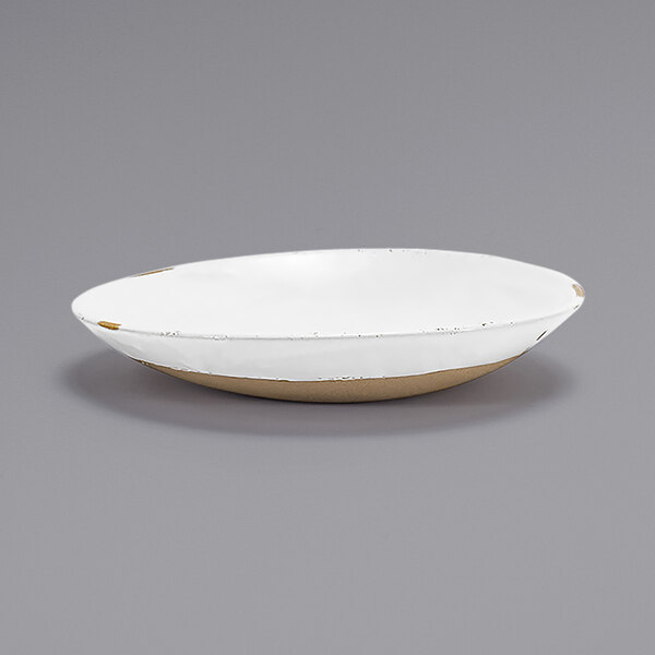 A white porcelain bowl with a gold rim.
