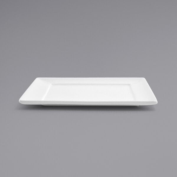 a white rectangular plate on a gray background