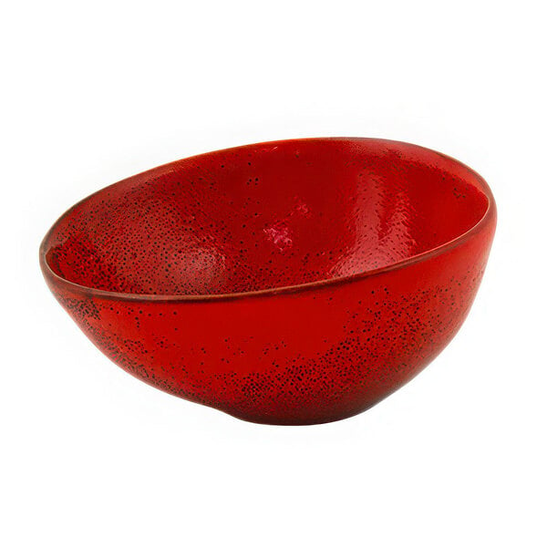 A red porcelain ramekin with black specks.