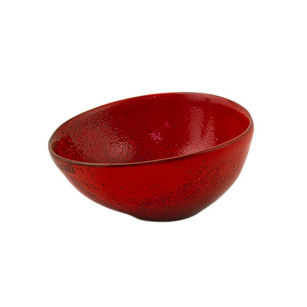 A white porcelain ramekin with red chili inside.