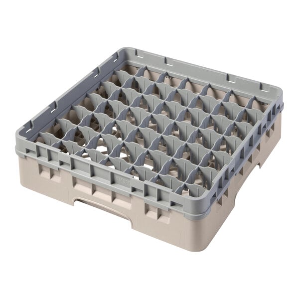A beige plastic Cambro rack with many compartments and holes.