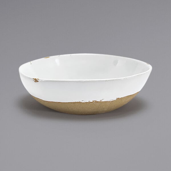 A white bowl with a brown rim.