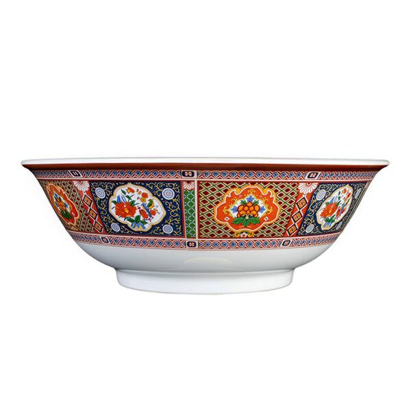 A close-up of a white Thunder Group melamine bowl with colorful peacock designs.