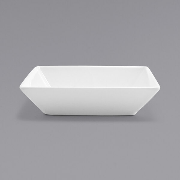 A white rectangular bowl on a gray background.