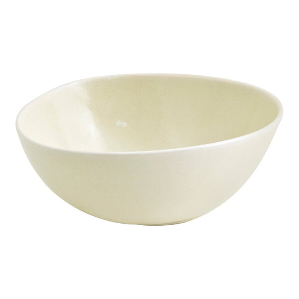 A round, vanilla bean-colored porcelain bowl with a 10 oz. capacity.