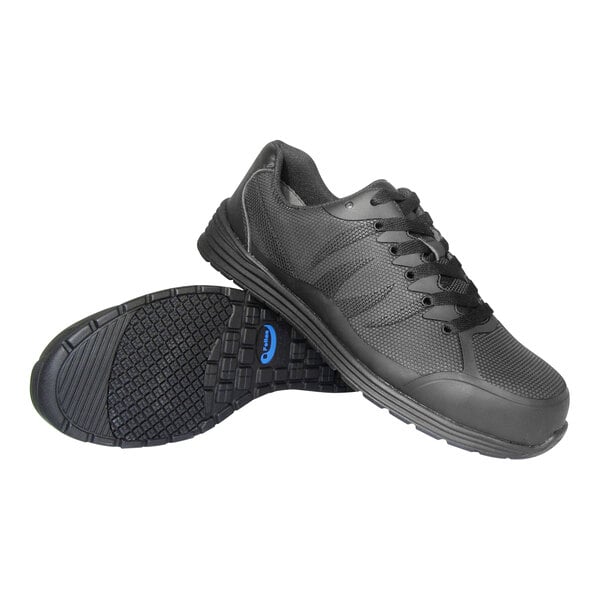 A pair of black athletic shoes with textured soles, one shoe standing upright and the other lying on its side to display the sole.