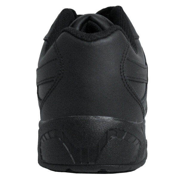 The bottom of a Genuine Grip men's black steel toe shoe with a rubber sole.