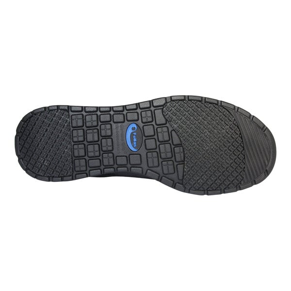 The image shows the black rubber outsole of a shoe with a textured, grid-like tread pattern and a blue oval logo in the center.