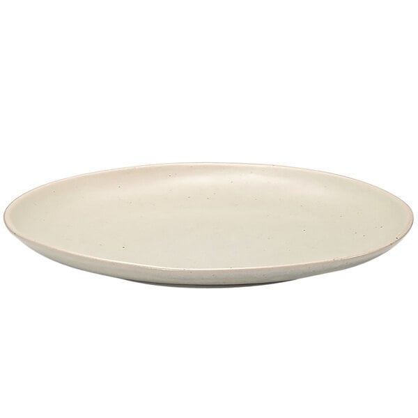 A white porcelain plate with a small brown rim.
