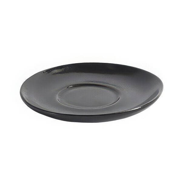 A black porcelain saucer with a small circle on it.