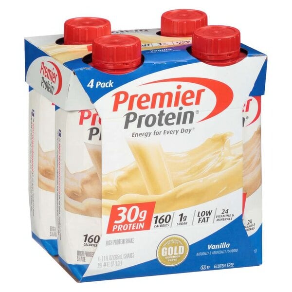 A group of Premier Protein Vanilla Protein Shake cartons with red plastic caps.