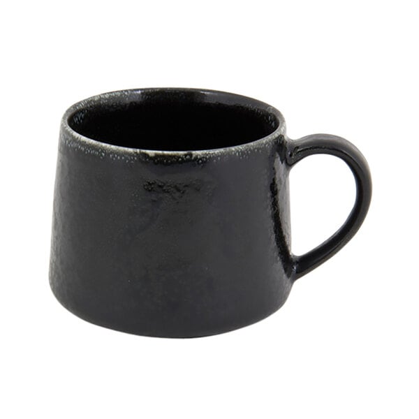 A black porcelain cup with a handle.