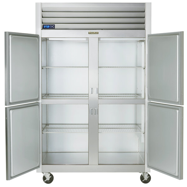 A white Traulsen G Series reach-in refrigerator with two open doors.