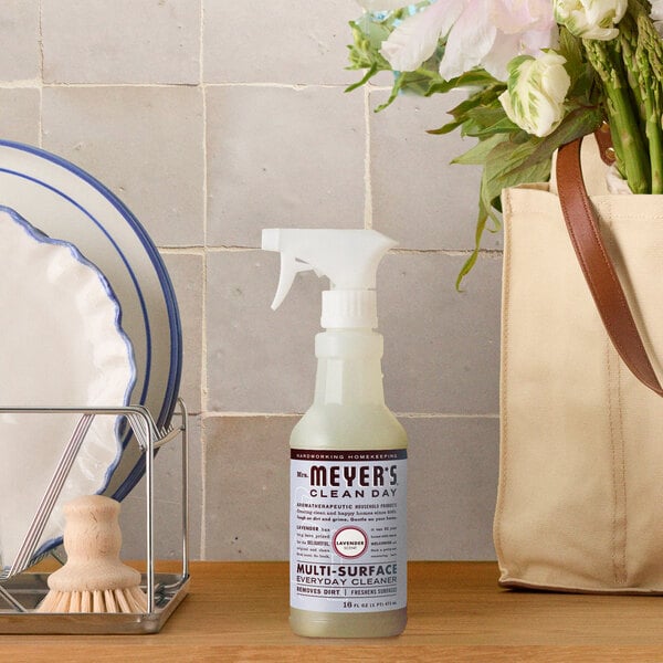 A bottle of Mrs. Meyer's Clean Day Lavender Multi-Surface Everyday Cleaner placed on a kitchen counter.