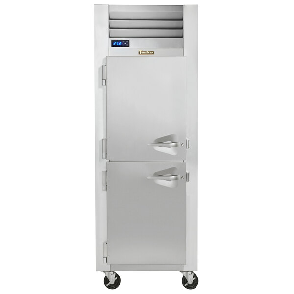 A Traulsen G Series half door reach-in refrigerator with left hinged doors.