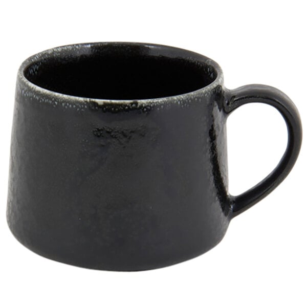 A black porcelain cup with a handle.