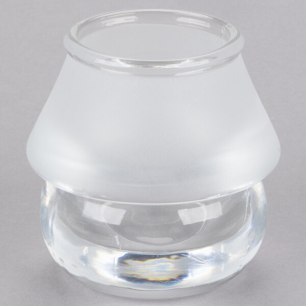 A clear glass container with a clear top on a Sterno 3 1/2" Frost Shade Lamp.