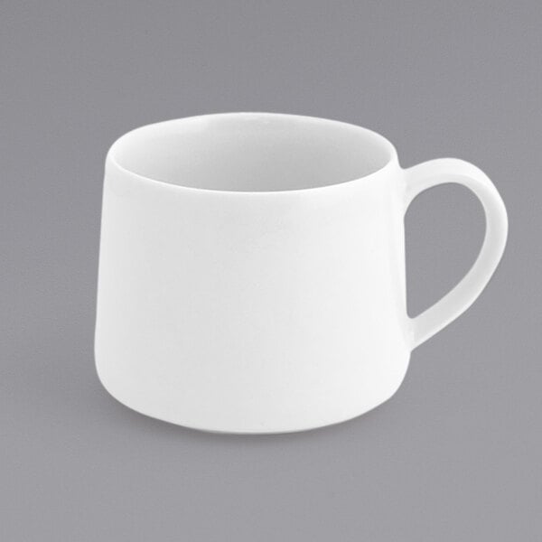 A Front of the House Kiln white porcelain cup with a handle.