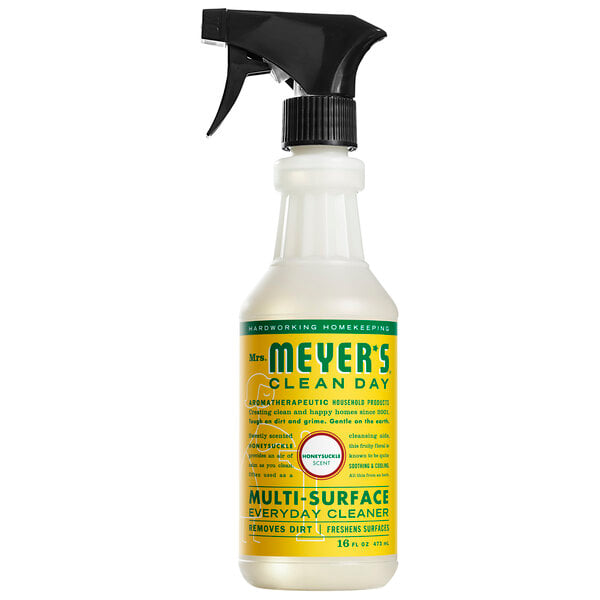 A white Mrs. Meyer's multi-surface cleaner spray bottle with a yellow label and black sprayer.