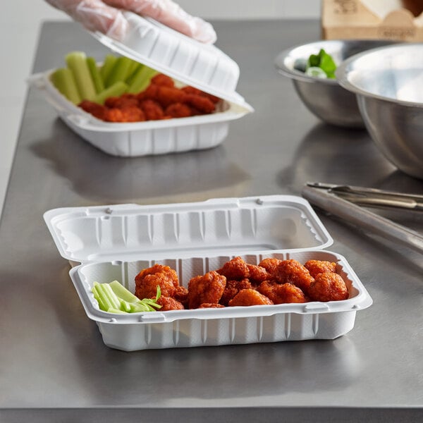 Chicken wings being packaged in a mineral-filled polypropylene container