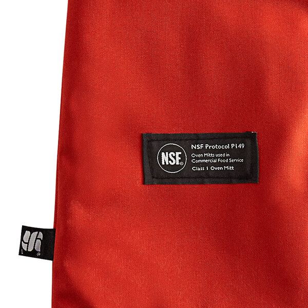 A San Jamar Cool Touch oven mitt with Kevlar web guard in red.
