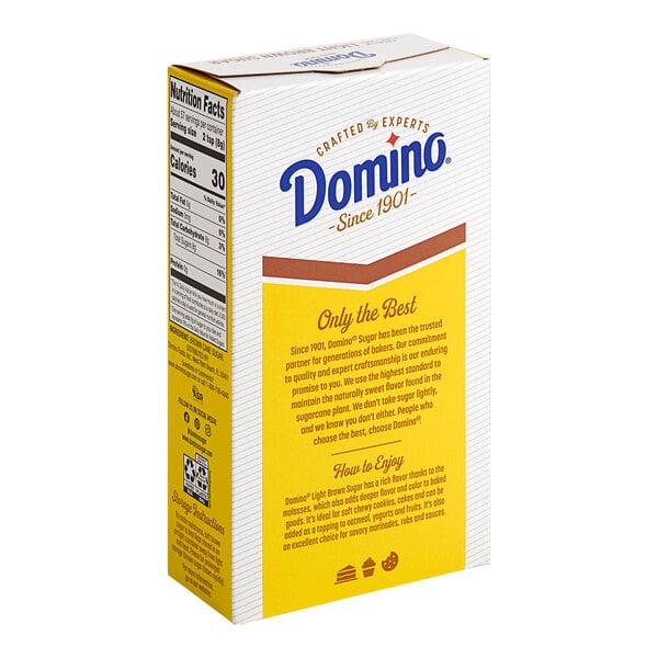 A yellow and white carton of Domino Light Brown Sugar on a white background.