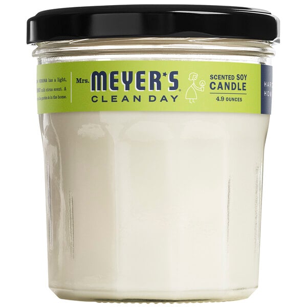 A Mrs. Meyer's Clean Day Lemon Verbena scented wax candle in a glass jar.