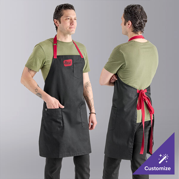 A person wearing a black Uncommon Chef Rebel apron with red straps.