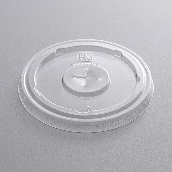 A clear plastic lid with a straw slot.