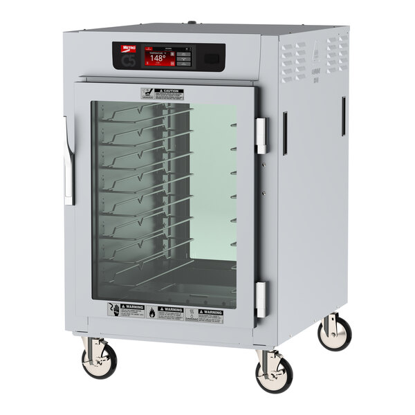 A white Metro C5 reach-in heated holding cabinet with clear glass doors.