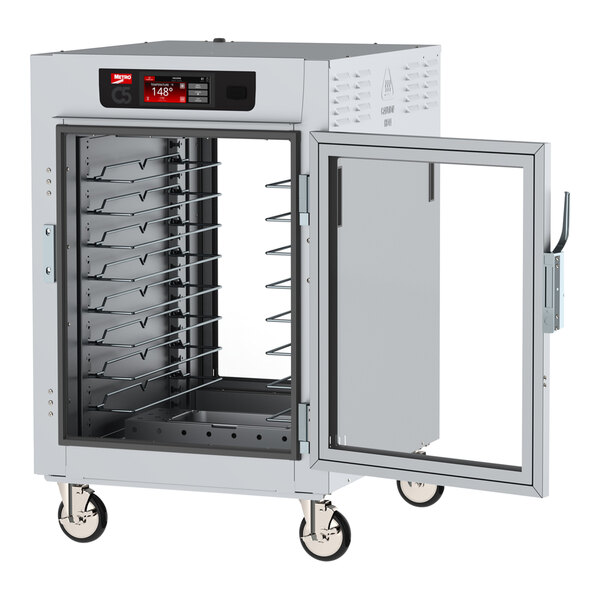 A Metro C5 heated holding cabinet with clear doors on wheels.