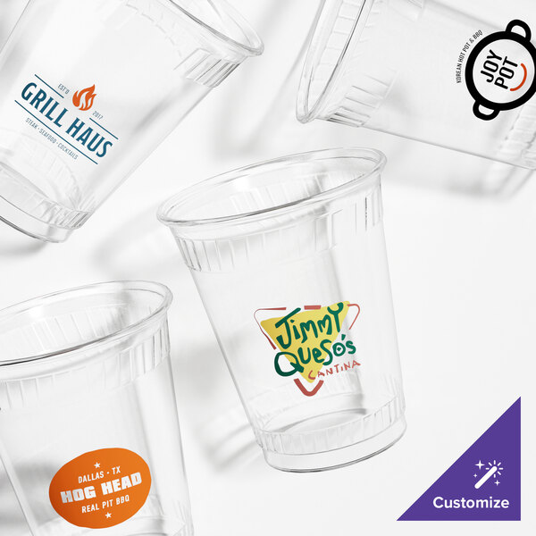 A close-up of a Fabri-Kal clear plastic cup with a black logo.