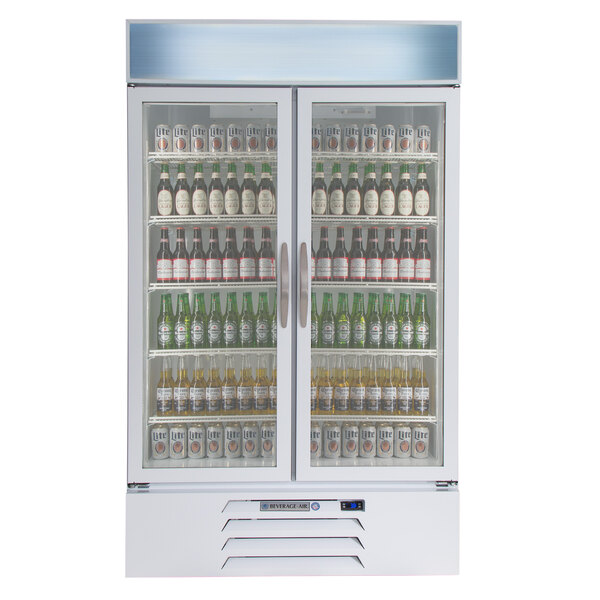 A Beverage-Air white glass door refrigerator filled with beer bottles.