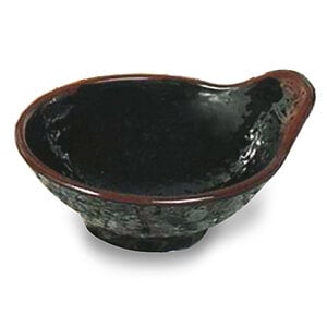 A Thunder Group Tenmoku Black Melamine Dip Bowl with a brown handle.