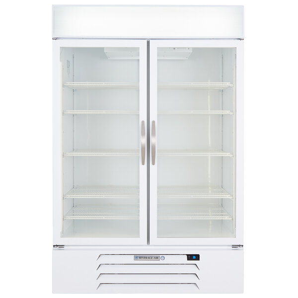 a white refrigerator with shelves