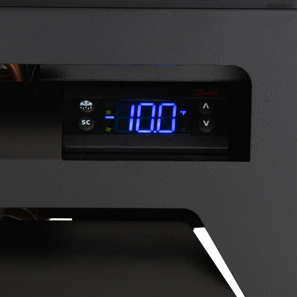 A Beverage-Air MarketMax glass door merchandising freezer with a digital temperature display.