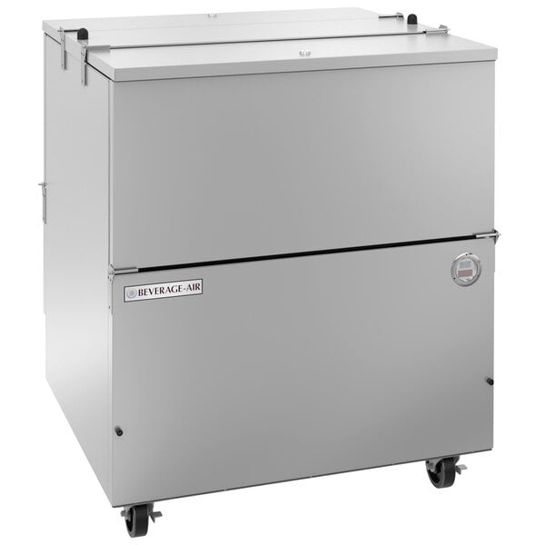 A Beverage-Air stainless steel milk cooler on wheels.