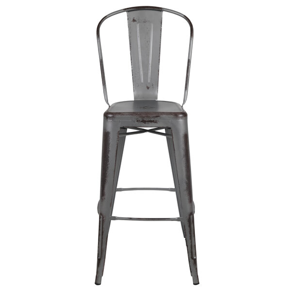 A Flash Furniture gray metal bar height stool with a vertical slat back and drain hole seat.