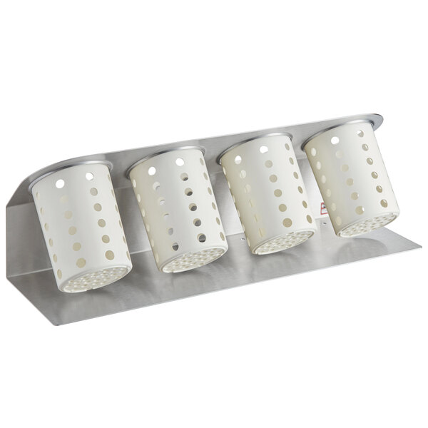 A white Steril-Sil flatware organizer with white perforated cylinders.