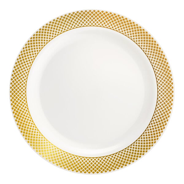 A round bone or ivory plastic plate with a gold lattice design around the rim.