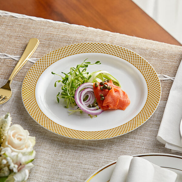 A Visions plastic plate with food on it on a table.